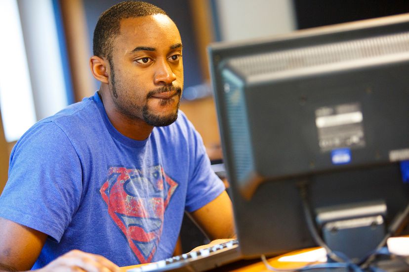 Male student using a computer