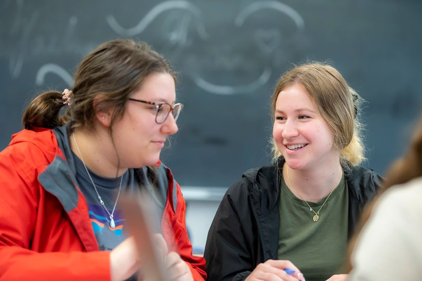 Female students in class smiling