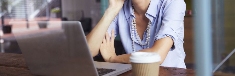 Online student with coffee and laptop