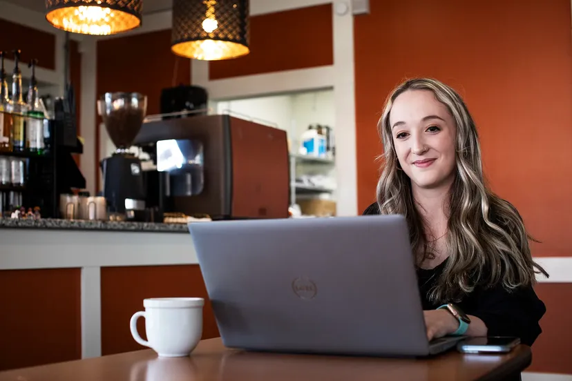 Catawba student on a laptop at a coffee shop